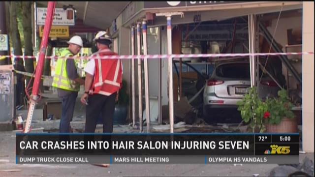 7 injured after car plows into hair salon